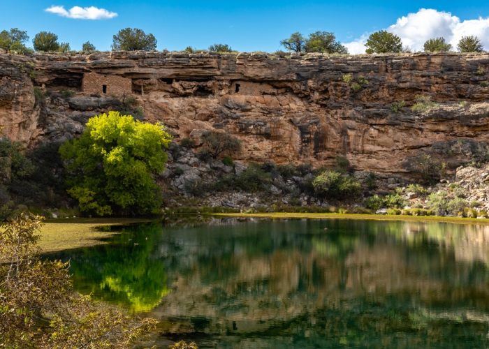 Ancient,Ruins,And,Surroundings,Reflect,On,The,Quiet,Water,Of